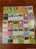 Full view of all 30 Pokemon cards laid out in rows showing colorful illustrations, names, and stats.