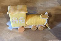 Wooden fabric yellow toy train with wheels and gingham roof