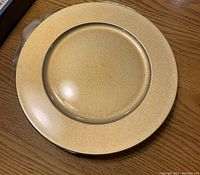 Single gold charger plate with speckled finish