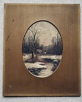 Front view of the oval oil painting on brown backing showing the winter house and landscape scene.
