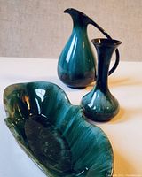 Three-piece set with two vases and one long bowl, teal green glaze on ceramic.