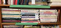 Shelf of books about art techniques, watercolor, flower and garden painting, and nature subjects