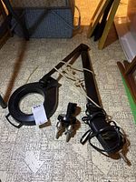 Overall view of task light showing clamp, arm, electrical cord and lamp head.
