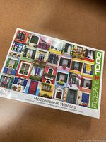 New sealed puzzle titled Mediterranean Windows showing colorful Mediterranean-style windows collage.