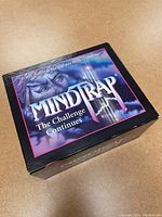 Mindtrap The Challenge Continues game box cover showing artwork and title