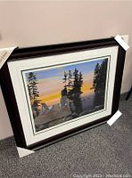 Framed artwork titled 'Kindred Spirits Together Forever' by John Harrington, showing the full framed piece leaning against a wall.