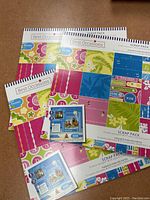 Image showing multiple Best Occasions Scrap Pack books with colorful patterned paper.