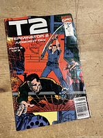 Front cover of Terminator 2: Judgment Day Part 2 of 3 comic book showing characters in action poses and branding text.