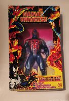 Front view of the Marvel Universe Spider-Man 2099 figure in original box showing figure in red and blue suit and Marvel characters on box art.