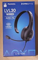 Front of box showing product image, branding, and key feature of 30mm high definition drivers and indication it is for PS4.