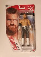 Front view of the WWE Buddy Murphy action figure in original Mattel Series 113 packaging, showing figure and front graphic