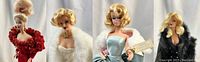 Four Barbie dolls in evening gowns arranged side by side against white backdrop