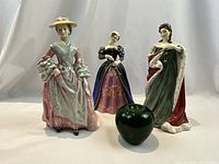 All three figurines with green glass apple for scale