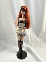 Front view of Silkstone Barbie in lingerie outfit on display stand