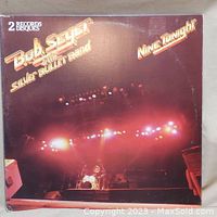 Front cover of the Bob Seger Nine Tonight album showing stage and lighting setup.