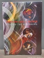 Front view of the DVD box with colorful artwork and band member photos, titled 'Emerson Lake & Palmer Beyond The Beginning'