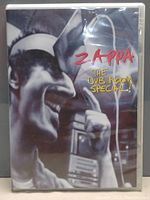 Front cover of DVD case showing an artistic black and white close-up photo of Frank Zappa singing with microphone, text in red and yellow "Zappa The Dub Room Special!"