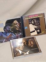 Three blues music CDs featuring legendary guitarists B.B. King and Albert King. Includes album covers with photographic and digital artwork of the artists playing guitar.