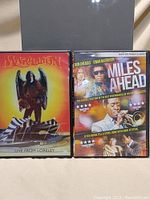 Front view of two DVDs: Marillion Live From Loreley and Miles Ahead by Sony Pictures Classics.