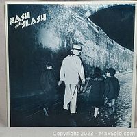 Front cover of the Nash the Slash vinyl album 'Children of the Night' showing a man in white suit with children walking down a cobblestone street.
