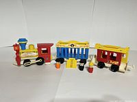 Full set of Fisher Price Little People Circus Train including engine, two cars, three figures and accessories