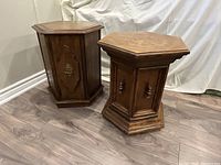 Two vintage solid oak hexagonal side tables displayed together on floor, front and side views visible.