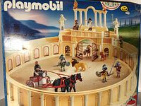 Box front showing assembled colosseum arena with figures, horses, chariot, and tiger inside.