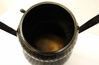 Top view of the open bronze flower pot showing interior and rim.