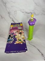 Front view of Tinkerbell PEZ dispenser with original candy pack showing Disney Fairies characters