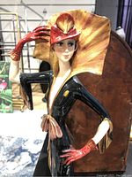 Front angled view of entire statuette showing posture and style