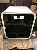 Front view of CubePro printer showing tinted door, touchscreen and CubePro logo