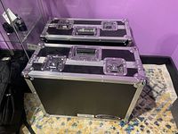 Two black ODY USA flight cases stacked, front view showing exterior and branding