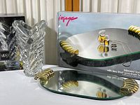 Mikasa crystal vase and matching mirrored vanity tray with gold shell handles, both shown with their original boxes in background.