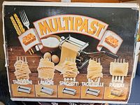 Box photo of Marcato Multipast pasta cutter set showing five different types of pasta cuts
