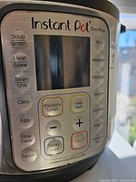 Close-up view of the Instant Pot Duo Plus digital control panel showing cooking options and functions
