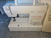 Pfaff Hobbymatic 935 dual feed sewing machine showing stitch selection panel and work area