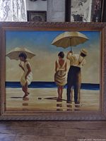 Full view of framed oil painting depicting three figures on beach with umbrellas