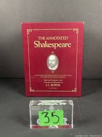 The original shipping box containing the 3 Shakespeare volumes, red with gold lettering and Shakespeare's image on front