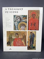 Front cover of book with four icon illustrations and title text.