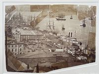 Full view of the aged albumen print showing Quebec Harbor with multiple ships and buildings, with tape repairs along edges and corners