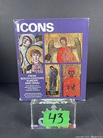 Front cover of the 'Icons from South Eastern Europe and Sinai' art book showing four religious icon images on a purple background and the title text.