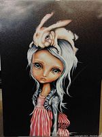 Close up of the art print showing a stylized girl with large eyes and a white bunny on her head
