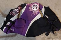 Full view of one of the Body Glove life jackets showing design, colors, straps and Body Glove branding clearly