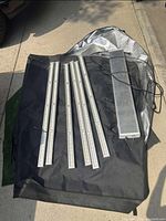 Components laid out: black tent fabric, LED light bars and power cables