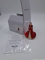 Figurine with certificate and original box, showing the full figure and packaging.