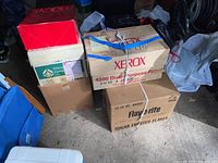 Stack of various cardboard boxes containing the lot items