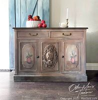 Front view of the vintage hand-painted buffet showing carved central panel and floral designs on doors.