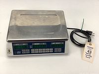 Full view of the stainless steel platform and digital display control panel with attached power cord.