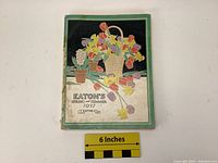 Front cover of the 1927 Eaton's catalogue showing the colorful floral illustration and the title text.