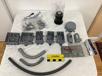 Complete lot displayed on white background including multiple grey electrical boxes, conduit connectors, bent conduits, switch covers, round cover, and black light fixture cover with glass dome.